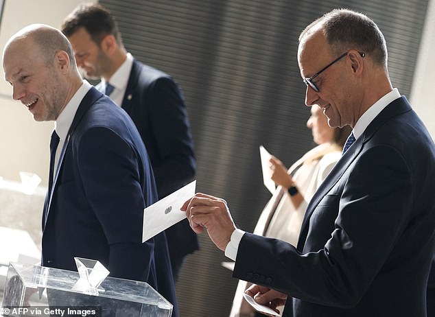 But this afternoon, after forcing another vote, he took 325 votes, meaning he is finally confirmed as the German chancellor