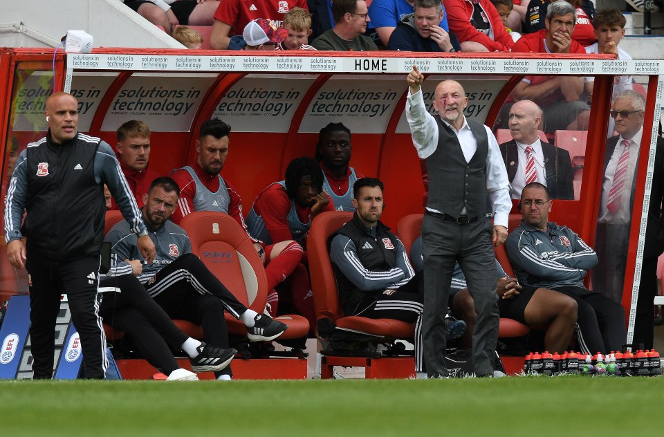 Swindon manager Ian Holloway on the sidelines during a soccer match.