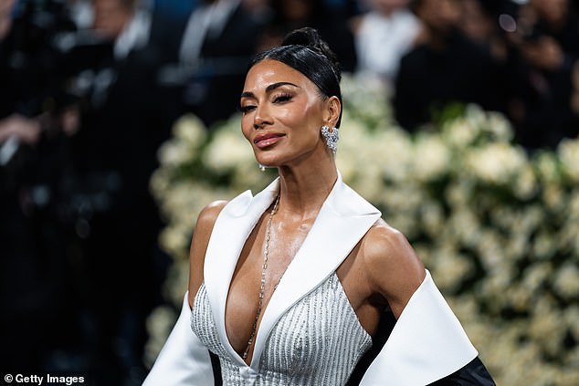 She wore a white gown designed by Prabal Gurung to the event, with sparkling pinstripes and a large black cape as she made her debut at the event