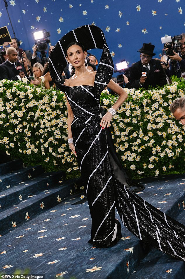 Also in Thom Browne was Demi Moore, who chose to wear an actual tie – potentially taking the theme a little too seriously