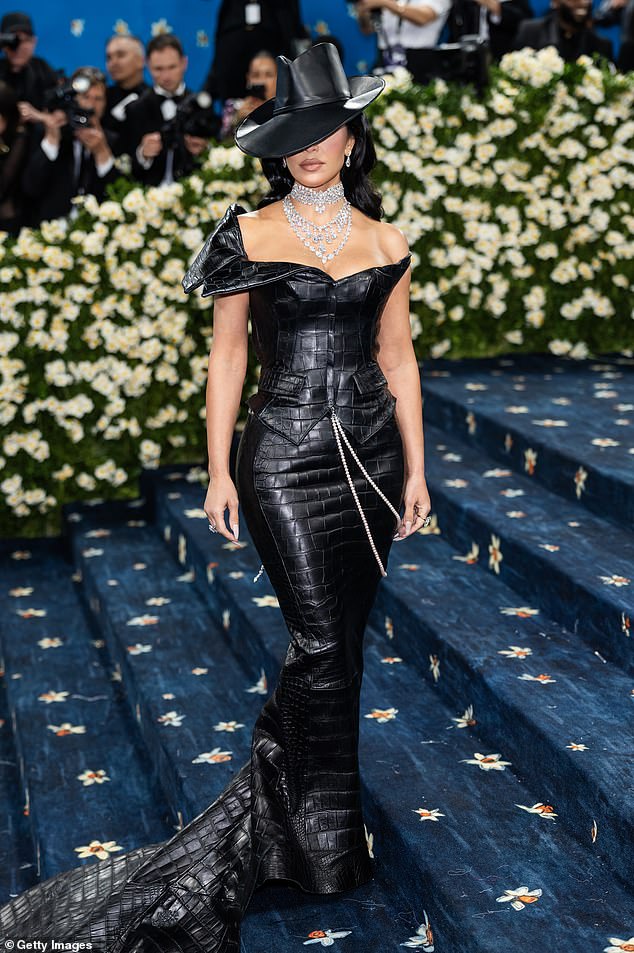 Kim Kardashian wore a floor-length leather gown and matching fedora from Chrome Hearts