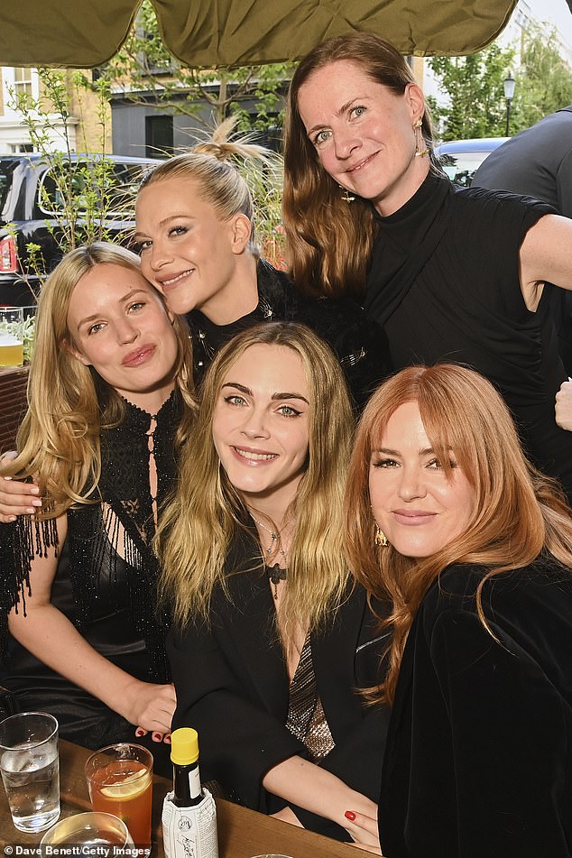 Georgia posed with Poppy, Cara, their sister Chloe Delevingne and Isla Fisher at the pre-drinks reception (L-R)