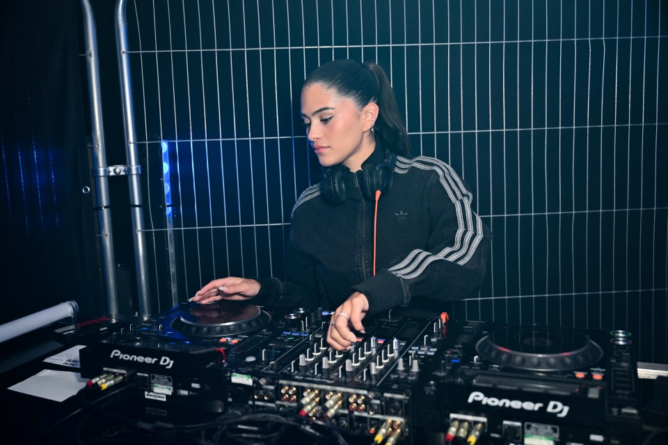 Woman DJing at an event.