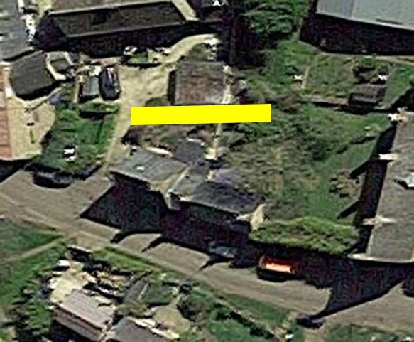 Aerial view of a property with a highlighted area.