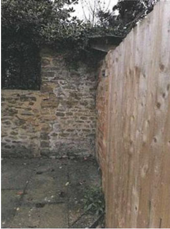 Disputed fence at Oxfordshire cottage.