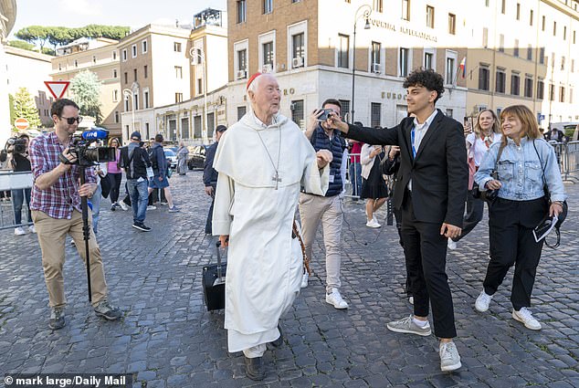 Lots have been drawn to sort out room allocation and Cardinal Radcliffe was one of the first to set the ball rolling – jumping out of a car and pulling a small suitcase behind him