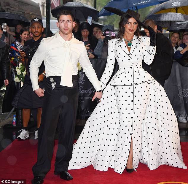 'Nick seems to have brought one facial expression with him here and it's a rather fierce, serious look, aimed at the banks of cameras with no sign here smiling or gazing at his wife,' James observed