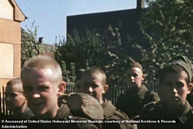 Members of what appear to be the Hitler Youth are seen in the American video