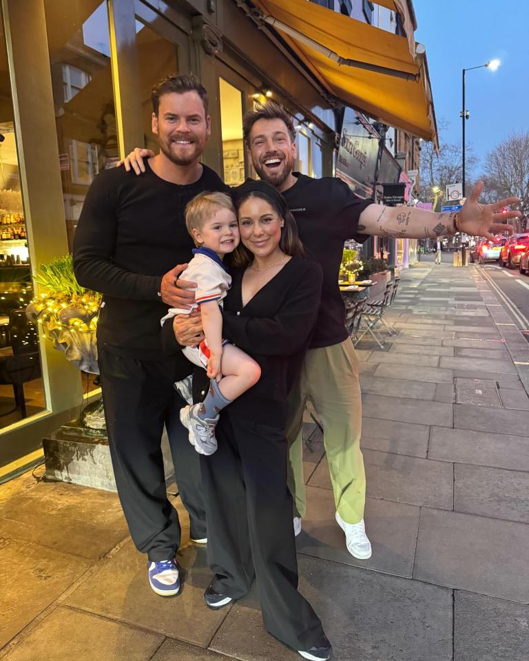 Sam Thompson with his sister, Louise Thompson, their child, and another man outside a restaurant.