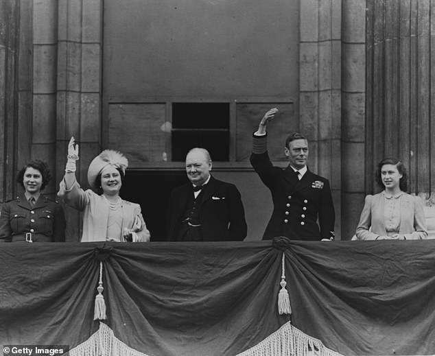 Pictured: Princess Elizabeth (the late Queen Elizabeth II), Queen Elizabeth, Winston Churchill, King George VI, and Princess Margaret Rose waving from the balcony of Buckingham Palace during VE Day celebrations