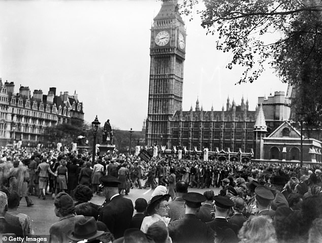 Pictured: VE Day celebrations in London at the end of the Second World War - some of the huge crowds gathered in Whitehall for the celebrations