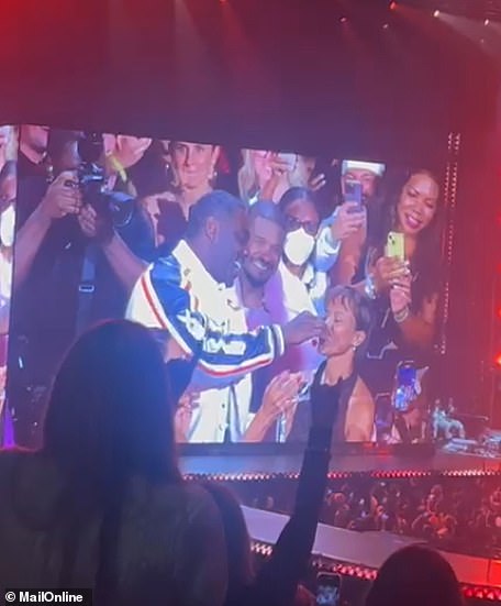 Handing Idris two cherries to feed his stunning partner, Usher sang, 'And now right now Idris, I'm going to let you feed your lovely lady in front of all this people tonight, oh yeah, come on'