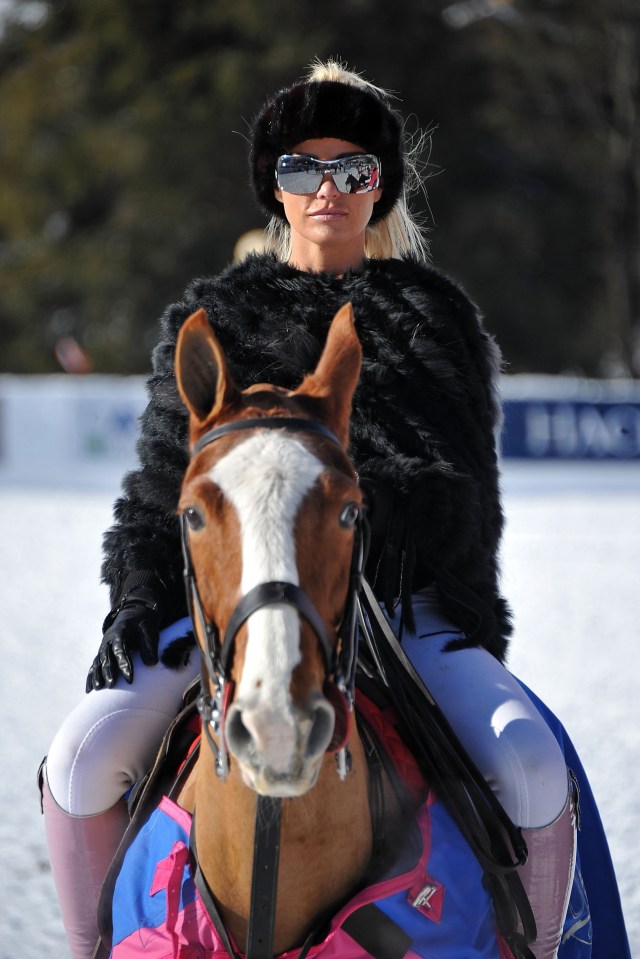 Katie Price at a snow polo event, riding a horse.