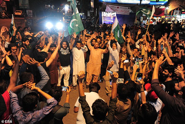 People shout anti-India slogans during a protest after India launched missile strikes in Pakistan