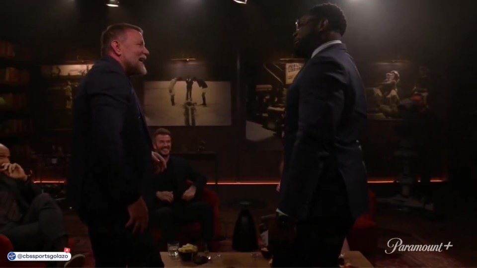 Micah Richards and David Beckham on a talk show.