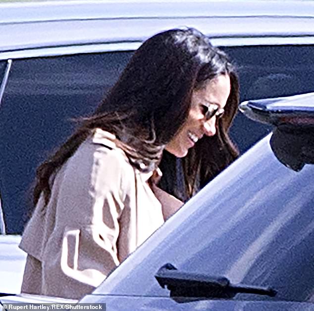 Meghan appeared completely smitten after Harry pulled her in for a kiss on the sidelines before leading his team to victory