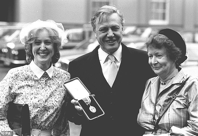 The naturalist was knighted by the Queen at an investiture at Buckingham Palace, London, with his wife Jane (right) and daughter Susan (left) in 1985