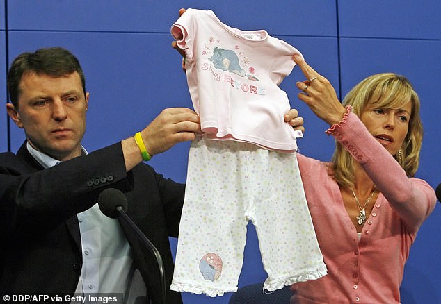 Kate and Gerry McCann, Madeleine's parents, hold up pyjamas similar to those of their daughter during a press conference in June 2007