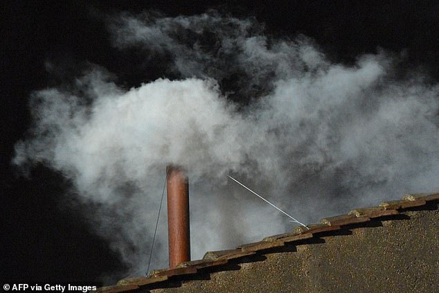 White smoke rises from the chimney on the roof of the Sistine Chapel meaning that cardinals elected a new pope on the second day of their secret conclave on March 13, 2013 at the Vatican