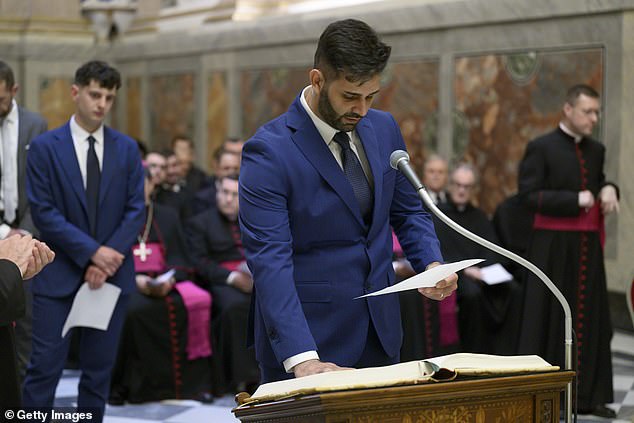Conclave officials sign the oath of confidentiality at the Apostolic Palace on May 06, 2025 in Vatican City