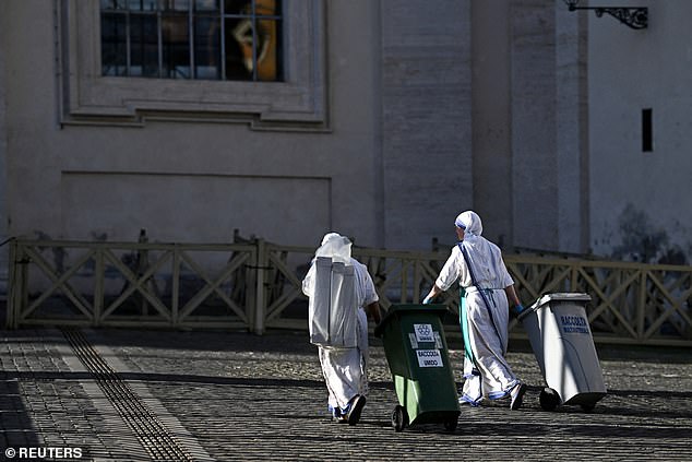 Nuns carry rubbish bins, ahead of the conclave to elect the next pope, in Rome, Italy, May 6, 2025