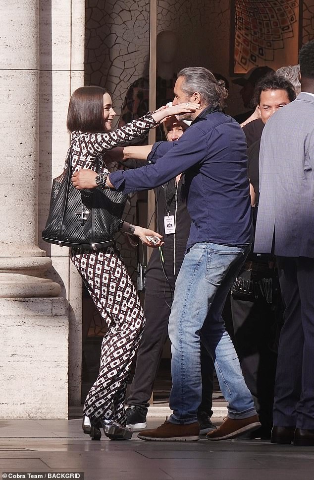 She was pictured hugging a member of the crew on the set