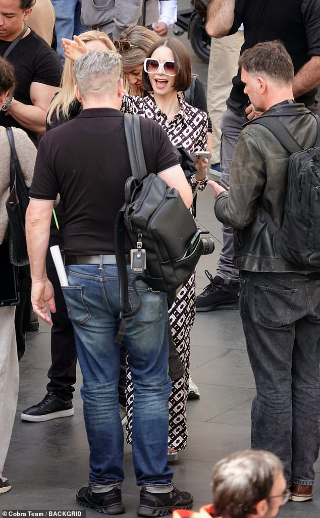 Lily was seen saying hello to a male crew member