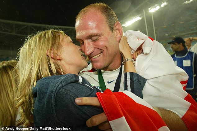 Lawrence Dallaglio is embraced by his then girlfriend Alice Corbett (now his wife Alice Dallaglio) after winning the rugby World Cup Final in 2003