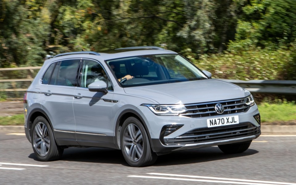 Volkswagen Tiguan driving on a road.
