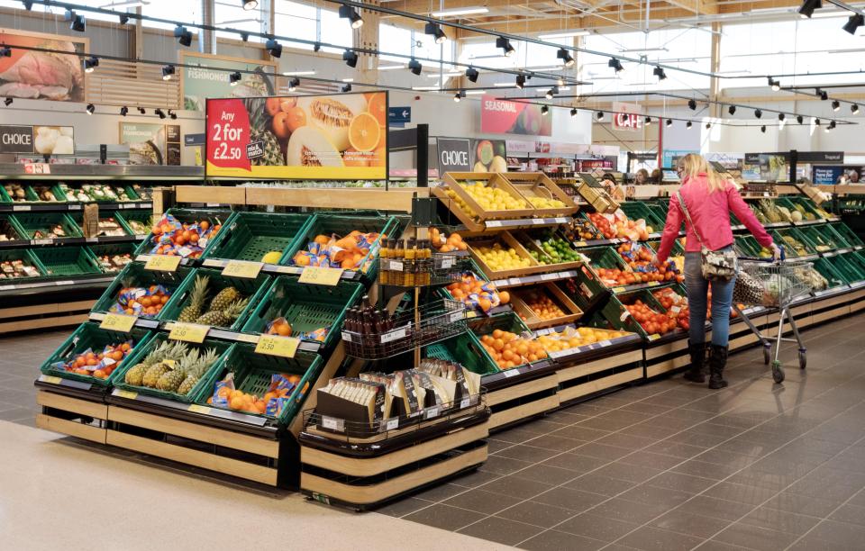 Woman shopping for fruit and vegetables in a supermarket.