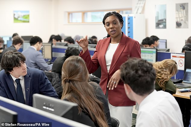 Tory leader Kemi Badenoch - seen visiting a school in London yesterday - has accused Sir Keir Starmer of a 'two-tier' approach