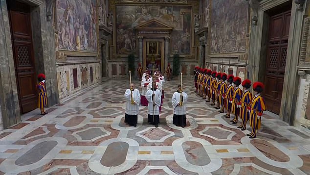 The master of papal liturgical ceremonies, Archbishop Diego Ravelli, calls out 'Extra omnes,' Latin for 'all out'