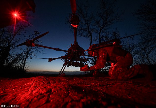 A serviceman of Special Police Battalion attaches a mine to a Vampire combat drone before flying over positions of Russian troops, amid Russia's attack on Ukraine, in Zaporizhzhia region, Ukraine April 29, 2025