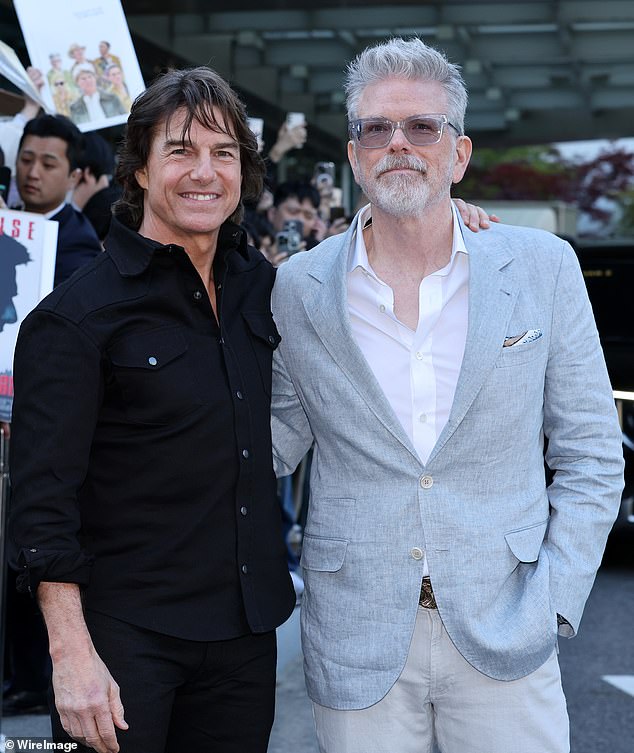 Cruise and director Christopher McQuarrie pose for media upon his arrival at Gimpo Airport on Wednesday in Seoul, South Korea