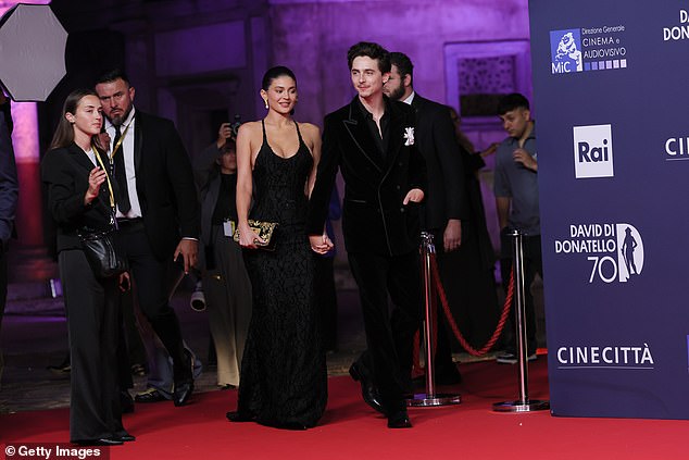 The couple were hand-in-hand as they made their way onto the red carpet to pose together