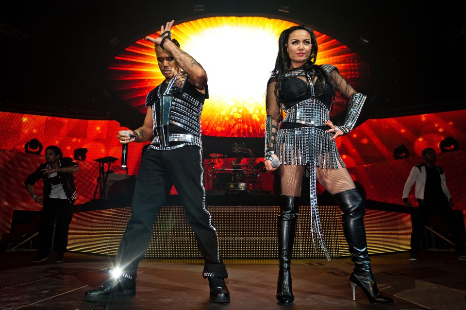 Ray Slijngaard and Anita Doth of 2 Unlimited performing on stage.