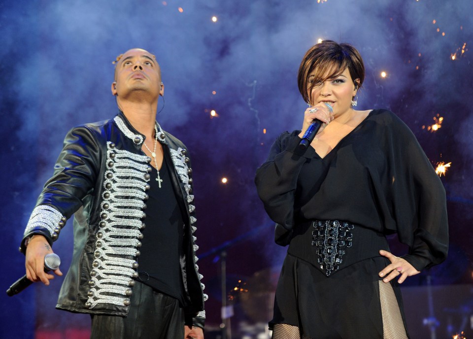 Ray Slijngaard and Anita Doth of 2 Unlimited performing on stage.