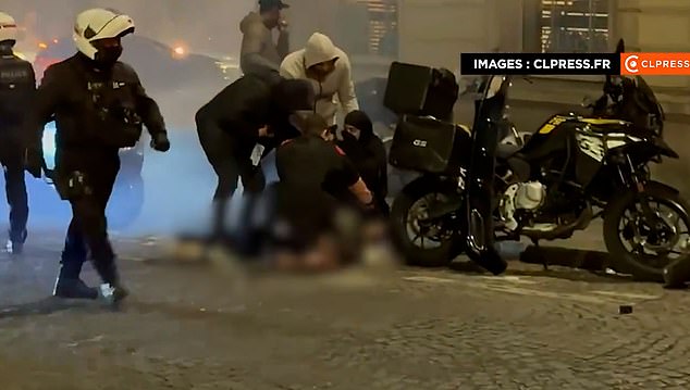Hooded French youths wearing Paris Saint Germain (PSG) shirts were reportedly also seen fighting with riot police on the Champs Elysée, and on nearby streets