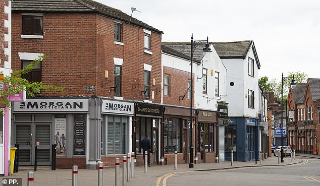 A very quiet high street in Runcorn, where the shutters have been closed on several shops