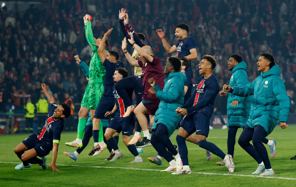 Paris St Germain players celebrating after a soccer match.