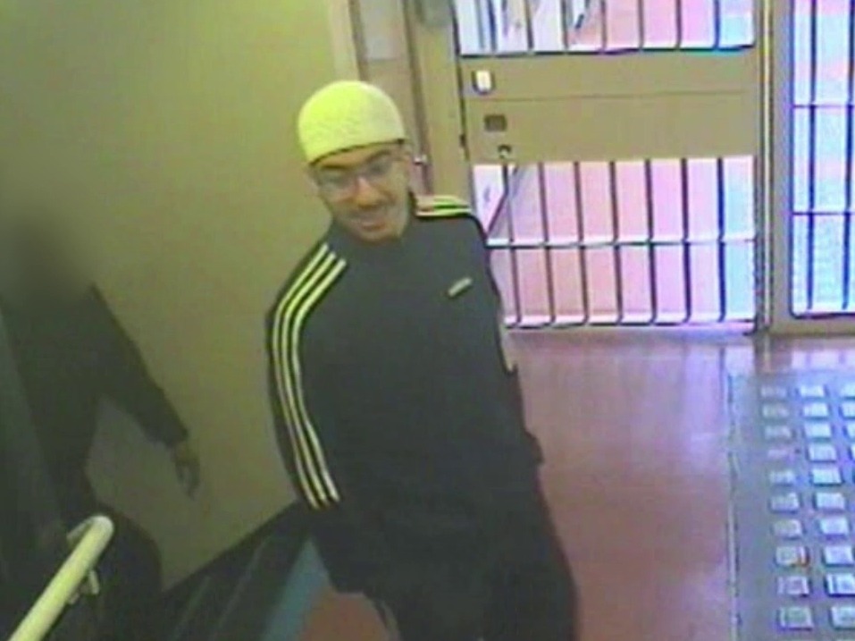 Security camera image of Hashem Abedi in an Adidas tracksuit and glasses.