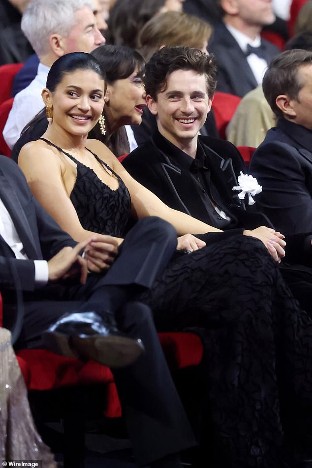 Kylie showed off her jaw-dropping curves in a plunging black gown as she cozied up to Timothee