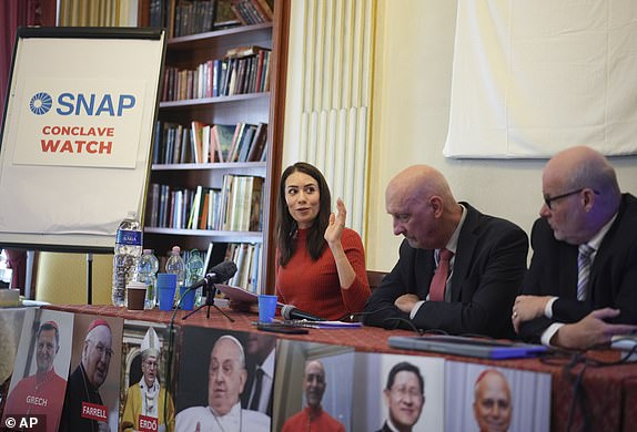 From left, SNAP, Survivors Network of those Abused by Priests, activists Sarah Pearson, Peter Isely and president Shaun Dougherty talk to reporters during a press conference, in Rome, Tuesday, March 25, 2025. (AP Photo/Andrew Medichini)
