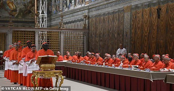 This photo taken and handout on May 7, 2025 by The Vatican Media shows cardinals before the start of the conclave to elect a new Pope in the Sistine chapel in The Vatican. (Photo by Handout / VATICAN MEDIA / AFP) / RESTRICTED TO EDITORIAL USE - MANDATORY CREDIT "AFP PHOTO / VATICAN MEDIA" - NO MARKETING - NO ADVERTISING CAMPAIGNS - DISTRIBUTED AS A SERVICE TO CLIENTS (Photo by HANDOUT/VATICAN MEDIA/AFP via Getty Images)