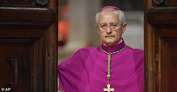 Vatican Master of Ceremonies, Archbishop Diego Giovanni Ravelli closes the doors of the Sistine Chapel at the Vatican to start the conclave to elect the successor of late Pope Francis, Wednesday, May 7, 2025. (Vatican Media via AP)