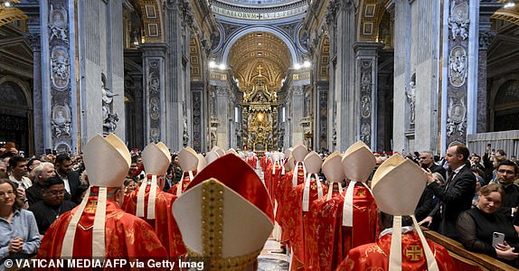 TOPSHOT - This photo taken and handout on May 7, 2025 by The Vatican Media shows cardinals during a holy mass for the Election of the Roman Pontiff, prior to the start of the conclave, at St Peter's Basilica in The Vatican. (Photo by Francesco Sforza / VATICAN MEDIA / AFP) / RESTRICTED TO EDITORIAL USE - MANDATORY CREDIT "AFP PHOTO / VATICAN MEDIA" - NO MARKETING - NO ADVERTISING CAMPAIGNS - DISTRIBUTED AS A SERVICE TO CLIENTS (Photo by FRANCESCO SFORZA/VATICAN MEDIA/AFP via Getty Images)