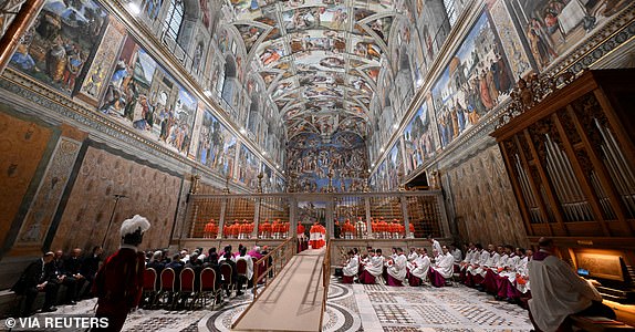 Cardinals stand in the Sistine Chapel, ahead of the conclave to elect the next pope at the Vatican, May 7, 2025. Vatican Media/Handout via REUTERS    THIS IMAGE HAS BEEN SUPPLIED BY A THIRD PARTY