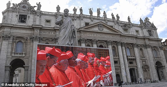 VATICAN CITY, VATICAN - MAY 7: Cardinals are seen on a giant screen in St. Peter's Square as they gather in the Sistine Chapel to begin the conclave to elect a new pope, at the Vatican on May 7, 2025. (Photo by isabella Bonotto/Anadolu via Getty Images)