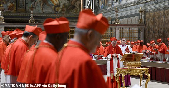 This photo taken and handout on May 7, 2025 by The Vatican Media shows cardinals before the start of the conclave to elect a new Pope in the Sistine chapel in The Vatican. (Photo by Handout / VATICAN MEDIA / AFP) / RESTRICTED TO EDITORIAL USE - MANDATORY CREDIT "AFP PHOTO / VATICAN MEDIA" - NO MARKETING - NO ADVERTISING CAMPAIGNS - DISTRIBUTED AS A SERVICE TO CLIENTS (Photo by HANDOUT/VATICAN MEDIA/AFP via Getty Images)