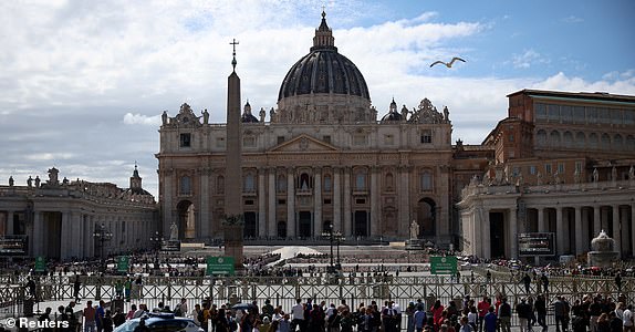 People gather in front of St. Peter's Square and St. Peter's Basilica, on the first day of conclave to elect the new pope, as seen from Rome, Italy May 7, 2025. REUTERS/Alkis Konstantinidis
